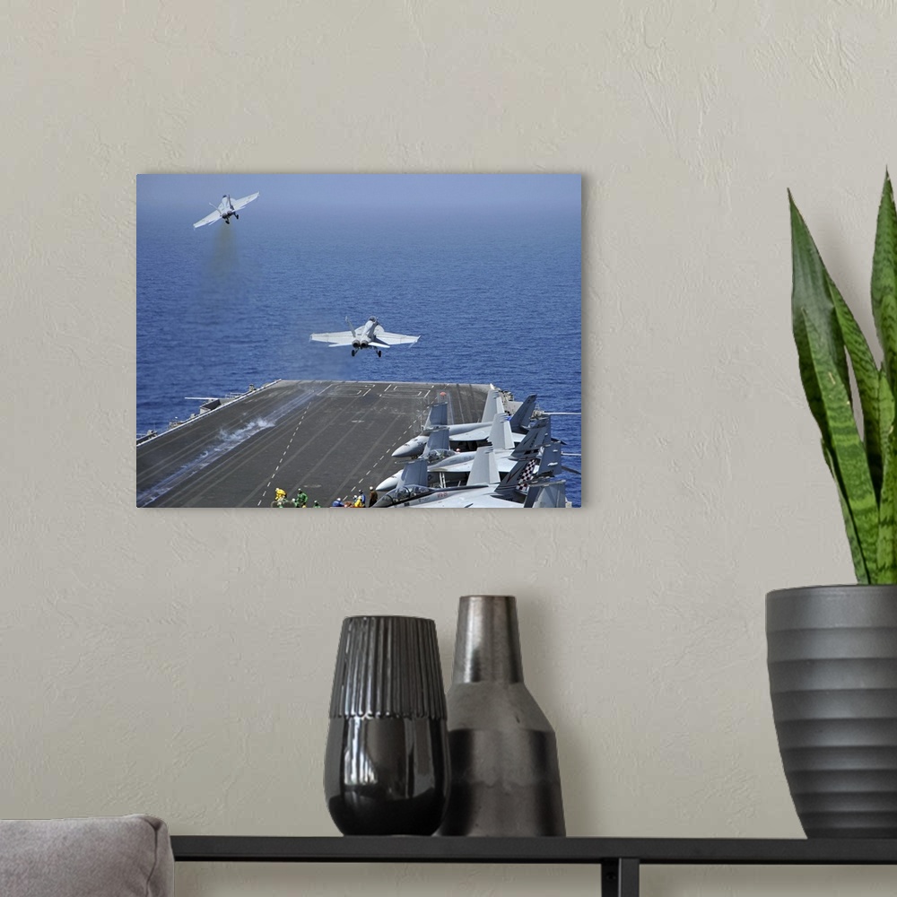 A modern room featuring Red Sea, March 17, 2011 - F/A-18F Super Hornets launch from the aircraft carrier USS Enterprise (...