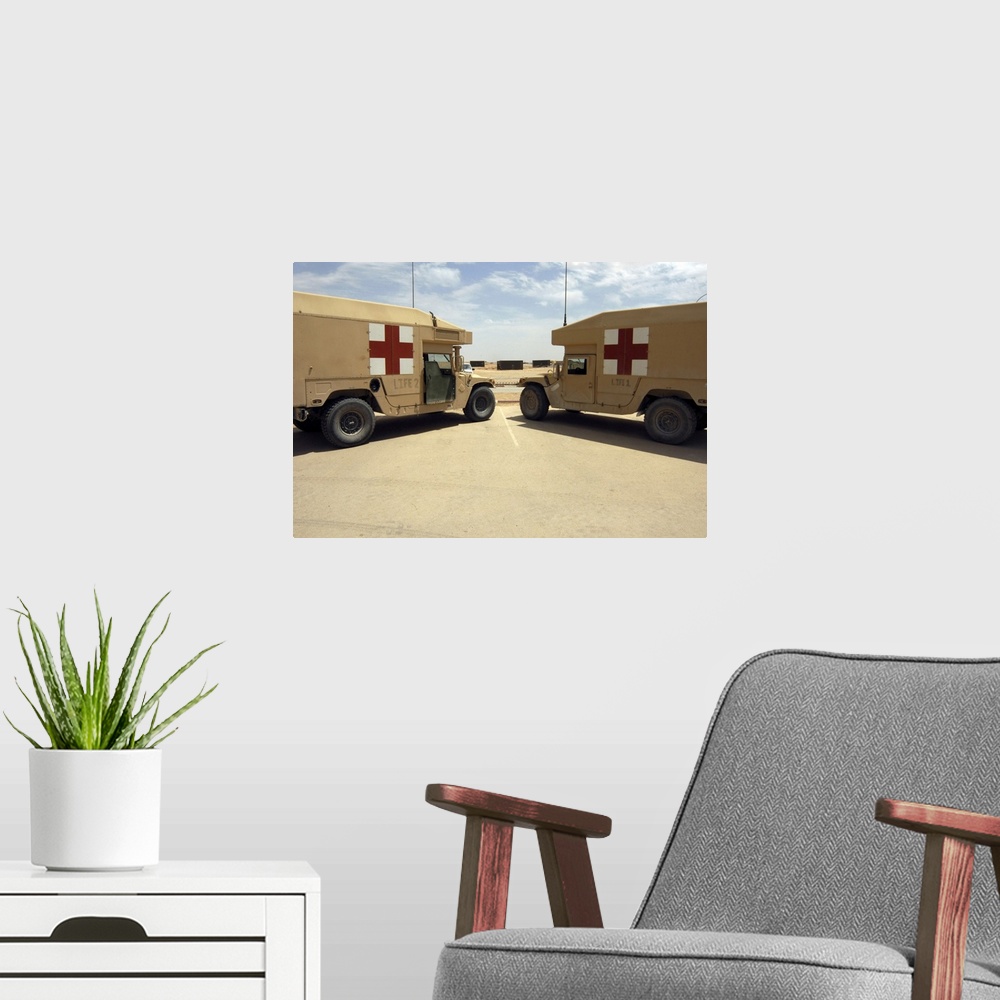 A modern room featuring Al Asad, Iraq -LIFE 1 and LIFE 2 field ambulances sit ready if the call comes to deliver injured ...
