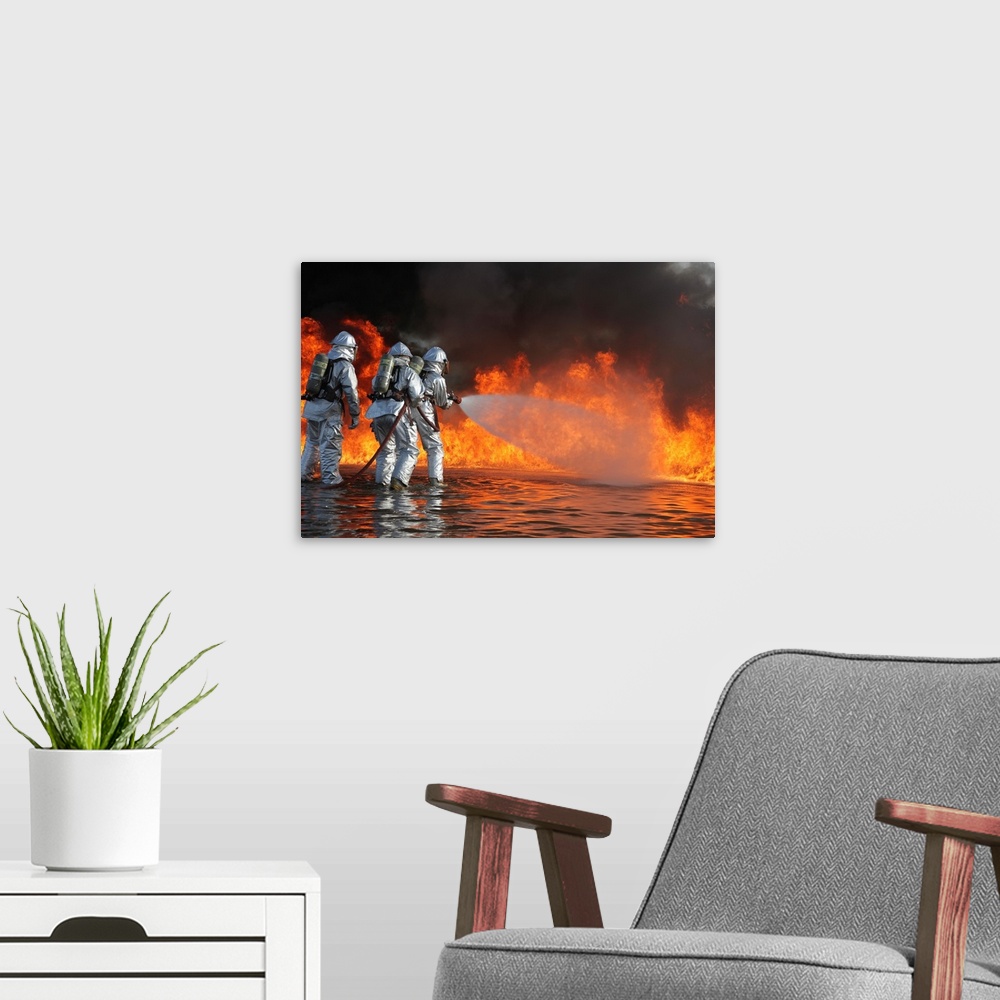 A modern room featuring Firefighting Marines battle a huge blaze.