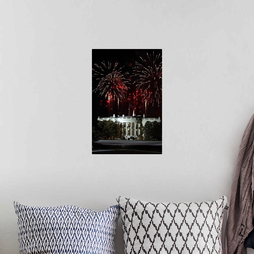 A bohemian room featuring Plumes of firewords explode over top of a lit up White House in Washington, DC.