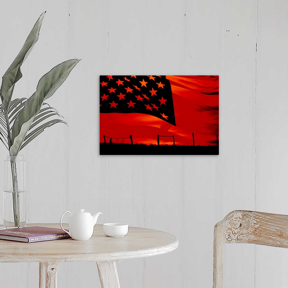 A farmhouse room featuring Huge photograph displays a broken fence in a desolate field as the sun begins to set.  Photograph...