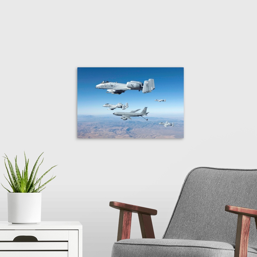 A modern room featuring Four A-10C Thunderbolt's from the 190th Fighter Squadron prepare to recieve fuel from a KC-135 ae...