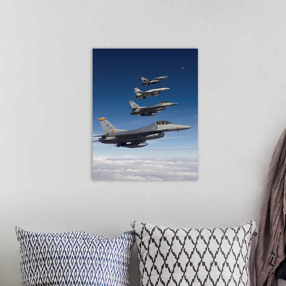 A bohemian room featuring Four F-16's stationed at the 162nd Fighter Wing in Tucson, Arizona, fly in formation during a tra...