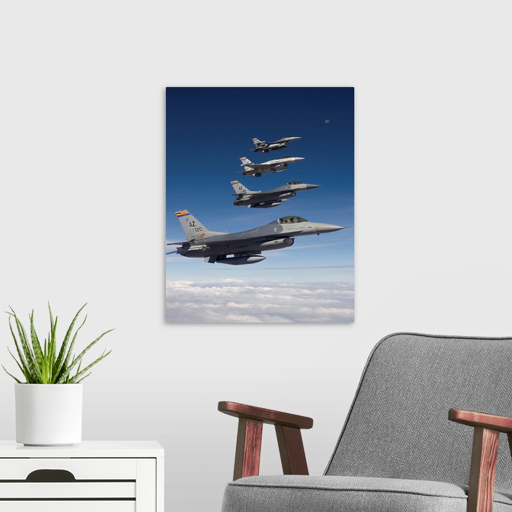 A modern room featuring Four F-16's stationed at the 162nd Fighter Wing in Tucson, Arizona, fly in formation during a tra...