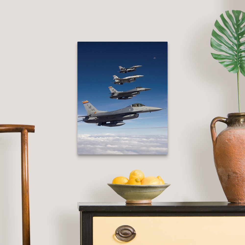 A traditional room featuring Four F-16's stationed at the 162nd Fighter Wing in Tucson, Arizona, fly in formation during a tra...