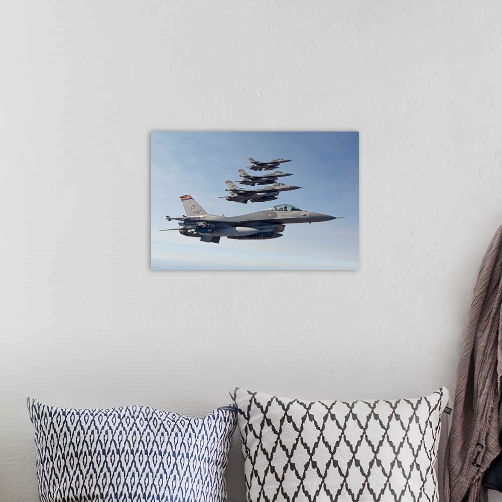 A bohemian room featuring Four F-16's from the Air National Guard Air Force Reserve Test Center fly in formation during a t...