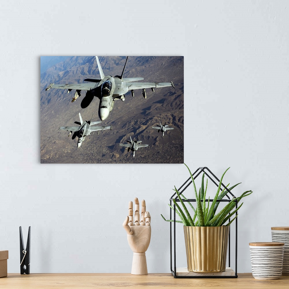 A bohemian room featuring November 25, 2010 - Four U.S. Navy F/A-18 Hornet aircraft fly over mountains in Afghanistan.