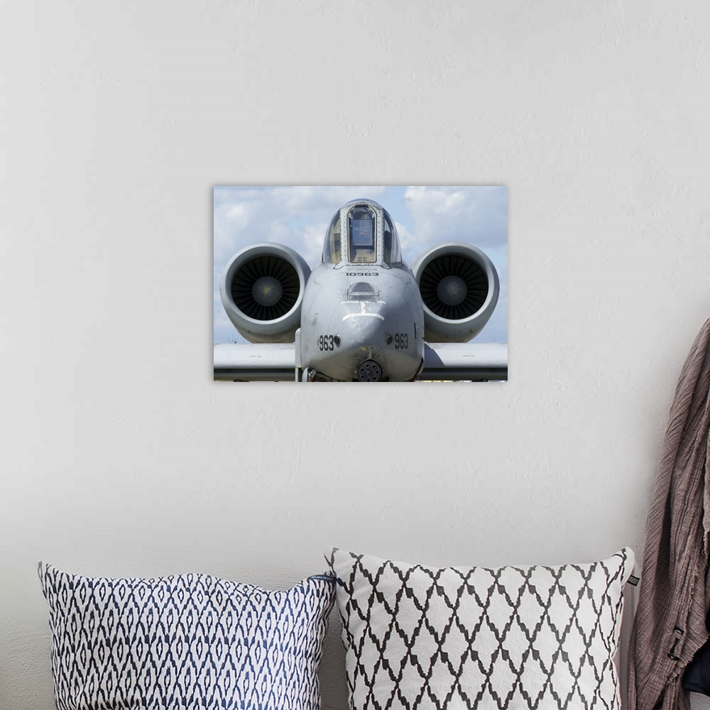 A bohemian room featuring Front view of an A-10A Thunderbolt II.