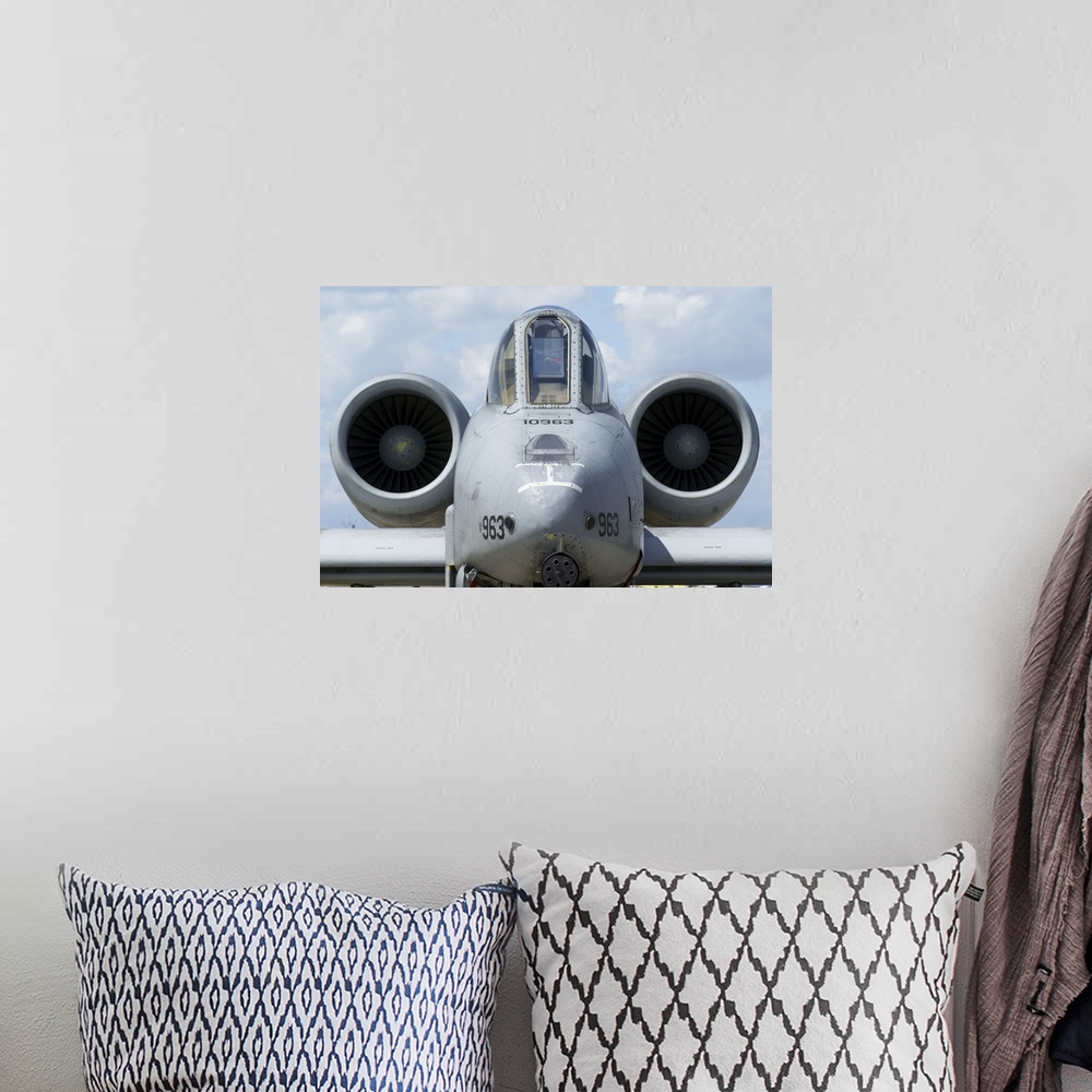 A bohemian room featuring Front view of an A-10A Thunderbolt II.
