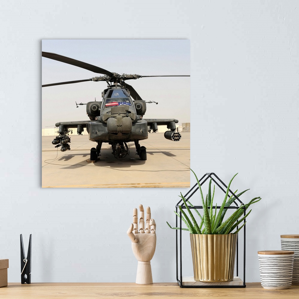 A bohemian room featuring Front view of an AH-64D Apache Longbow.
