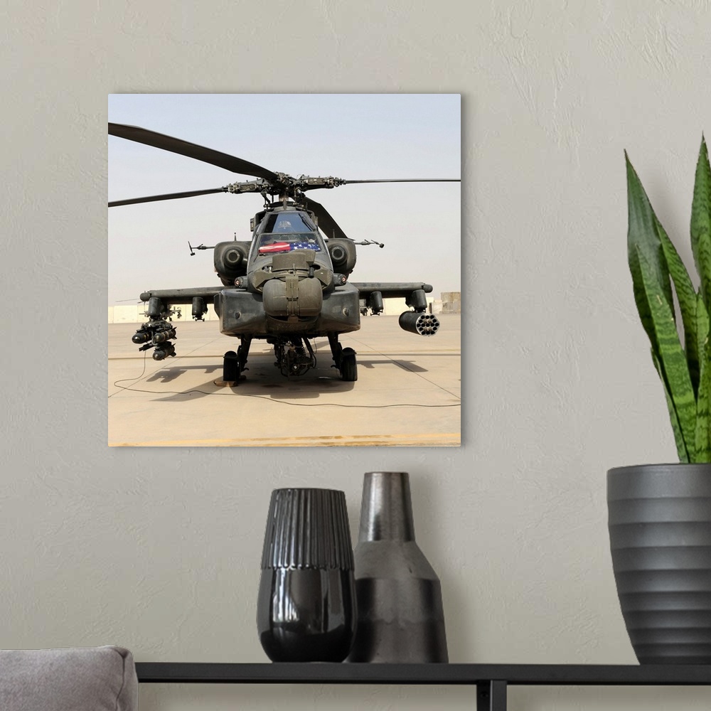 A modern room featuring Front view of an AH-64D Apache Longbow.