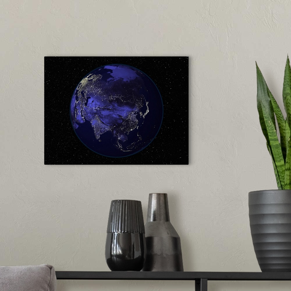 A modern room featuring Full Earth at night showing city lights centered on Asia