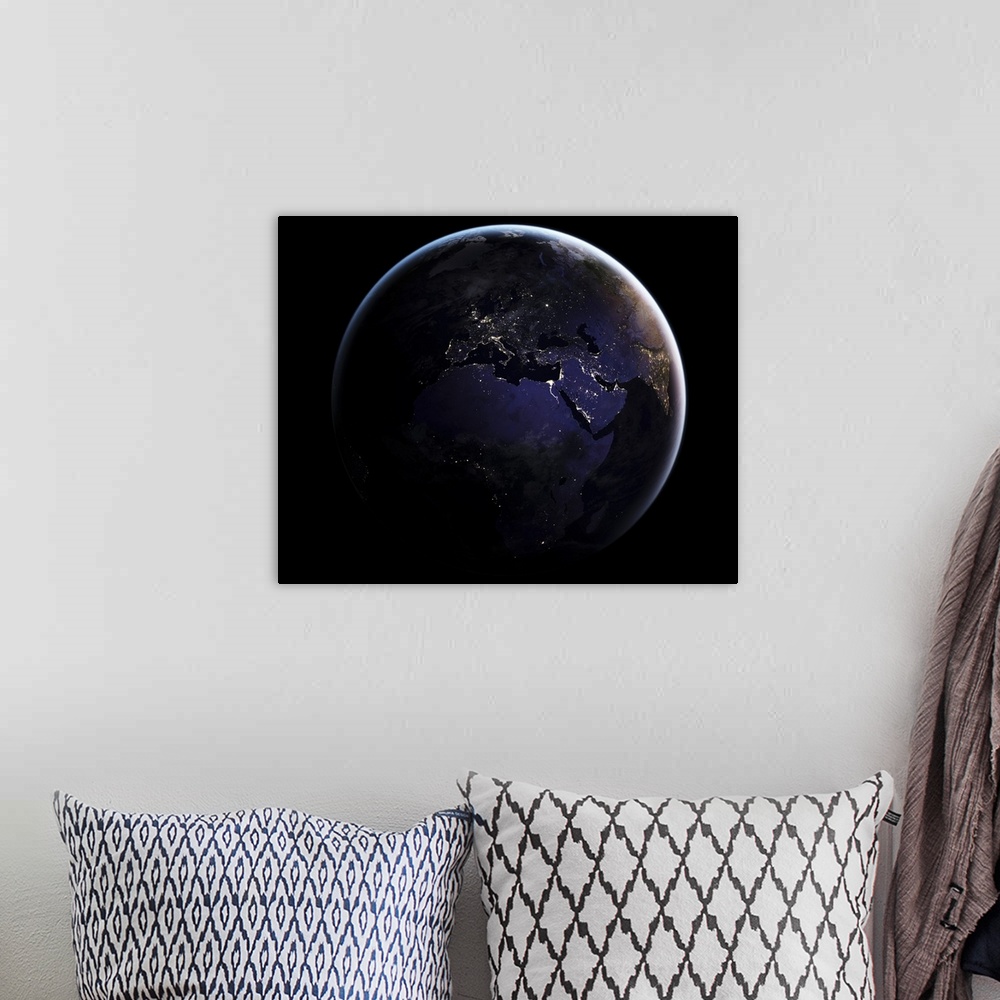 A bohemian room featuring Full Earth showing city lights of Europe at night.