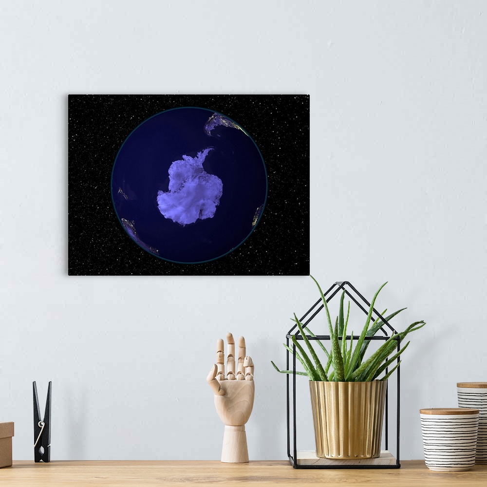 A bohemian room featuring Fully dark city lights image of Earth centered on the South Pole