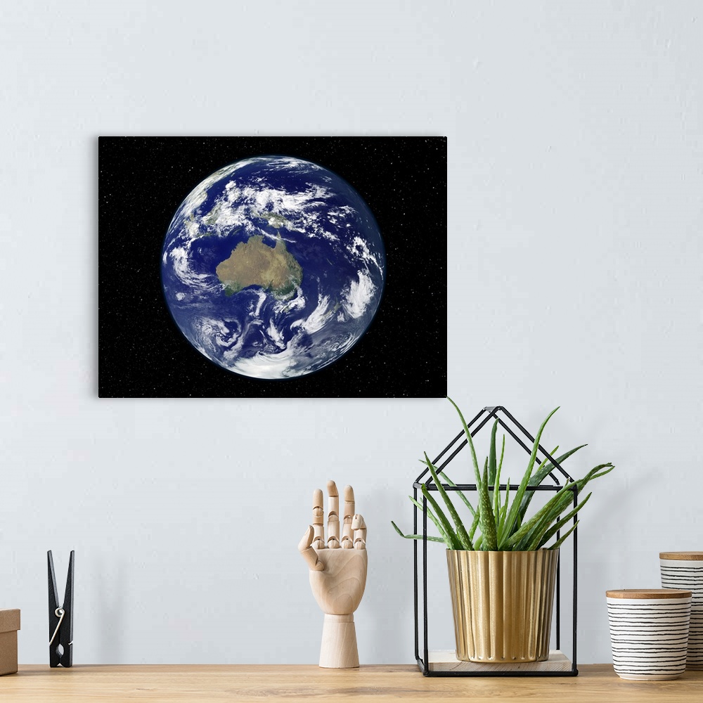 A bohemian room featuring Fully lit Earth centered on Australia and Oceania