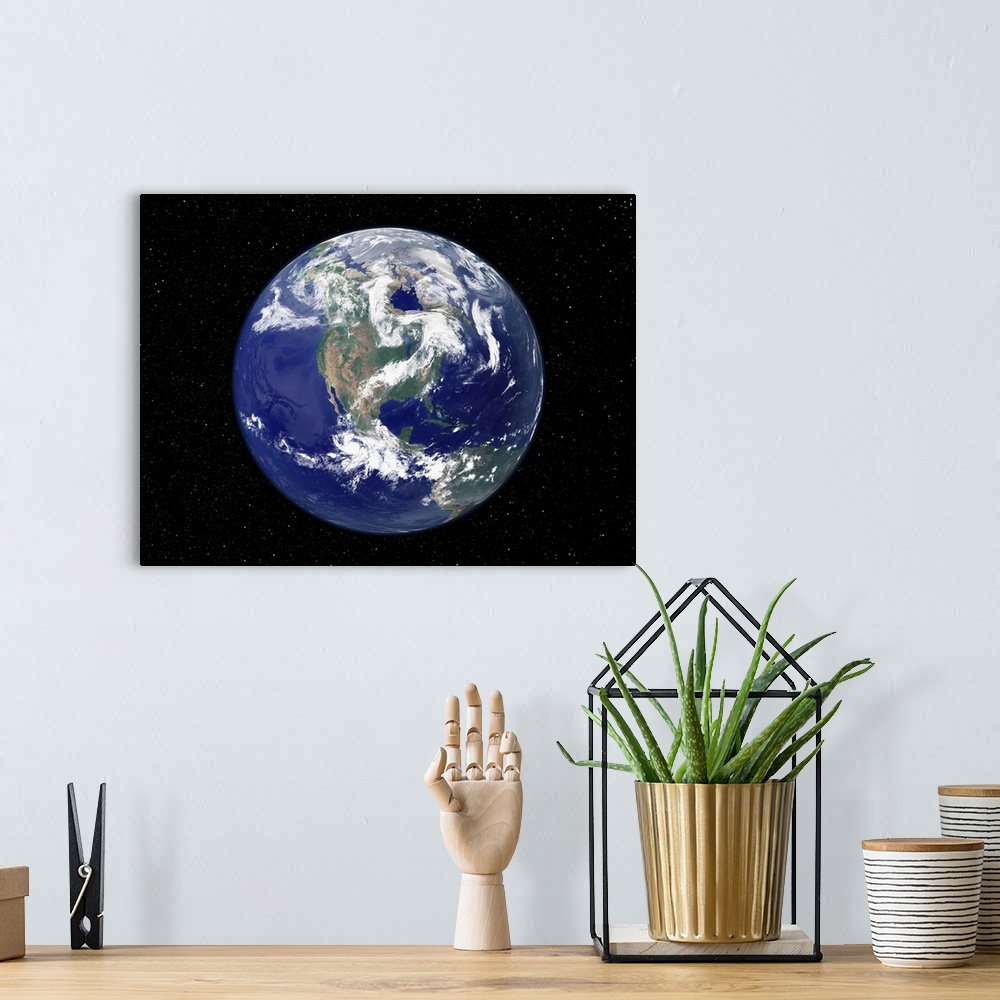 A bohemian room featuring Photograph of the Earth as seen from space, where the continent and weather patterns are clearly ...