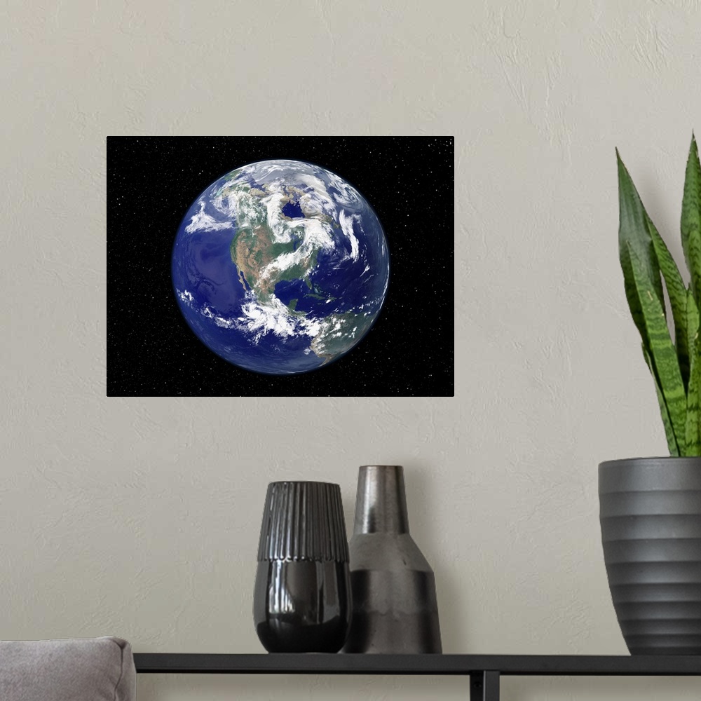 A modern room featuring Photograph of the Earth as seen from space, where the continent and weather patterns are clearly ...