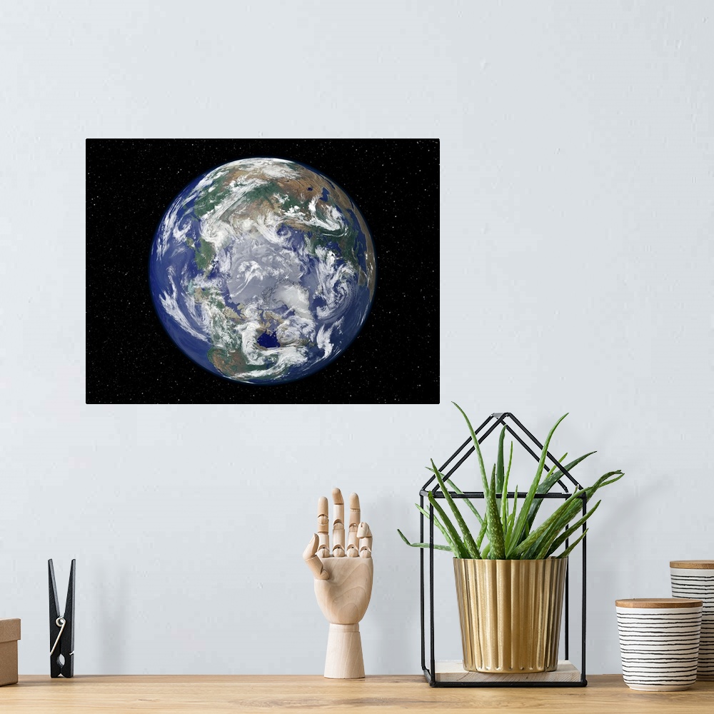A bohemian room featuring A view of planet earth from space looking directly down at the north pole.