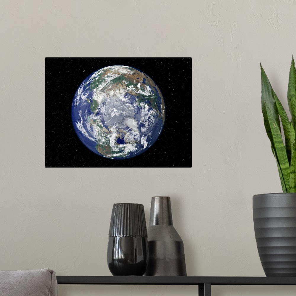 A modern room featuring A view of planet earth from space looking directly down at the north pole.