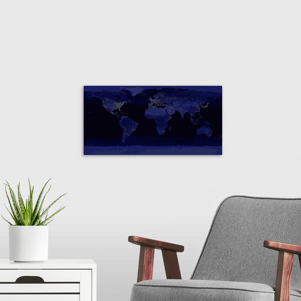 A modern room featuring A large photograph of the world taken at night showcasing city lights.