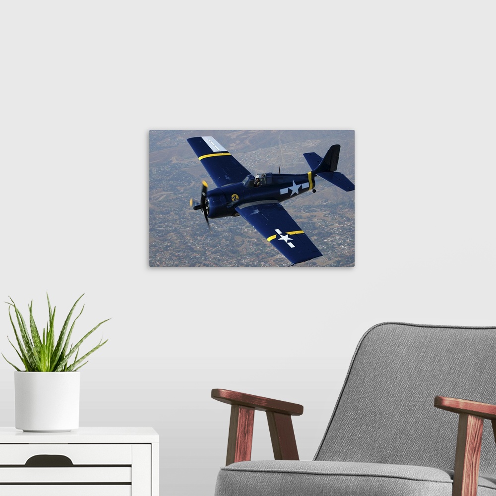 A modern room featuring Grumman F4F Wildcat flying over Chino, California..