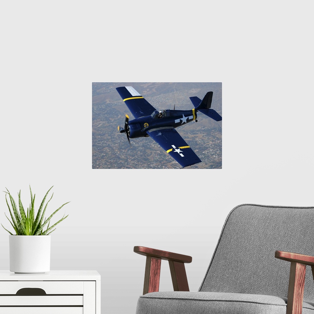 A modern room featuring Grumman F4F Wildcat flying over Chino, California..