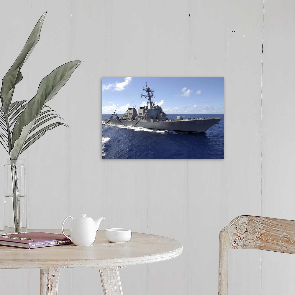 A farmhouse room featuring Big canvas photo art of a navy ship in the ocean.