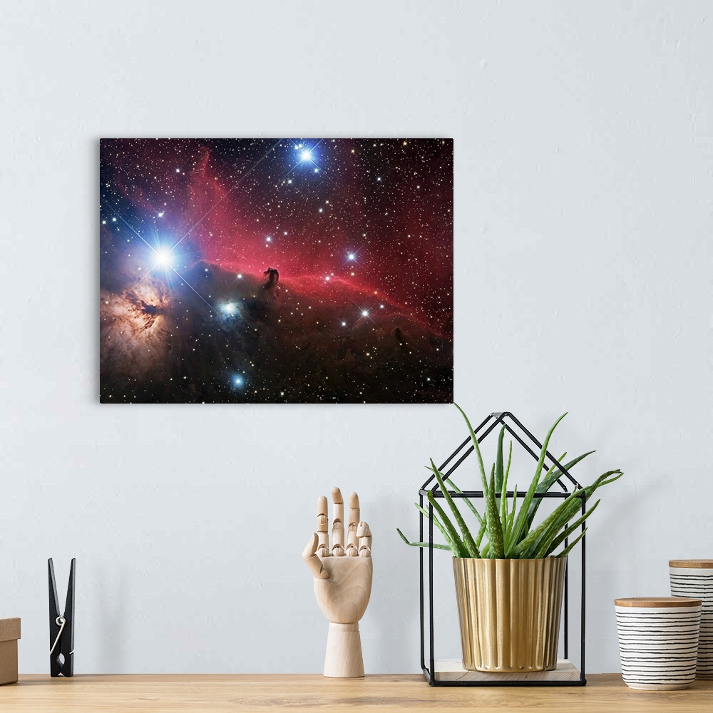 A bohemian room featuring Space photograph of glowing clouds of nebulae in the Orion constellation system with a multitude ...