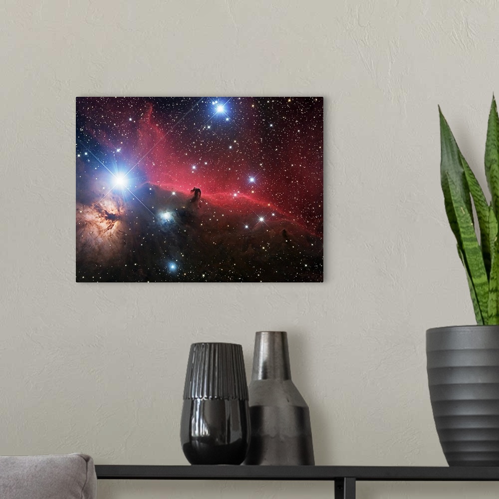 A modern room featuring Space photograph of glowing clouds of nebulae in the Orion constellation system with a multitude ...