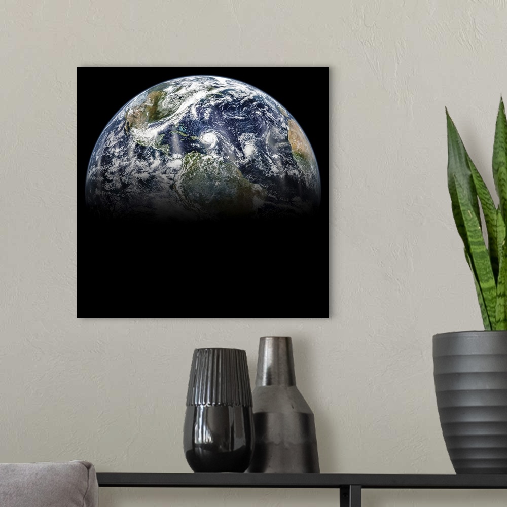 A modern room featuring Hurricane Katia, Hurricane Irma and Hurricane Jose lined up in a mosaic image of planet Earth.