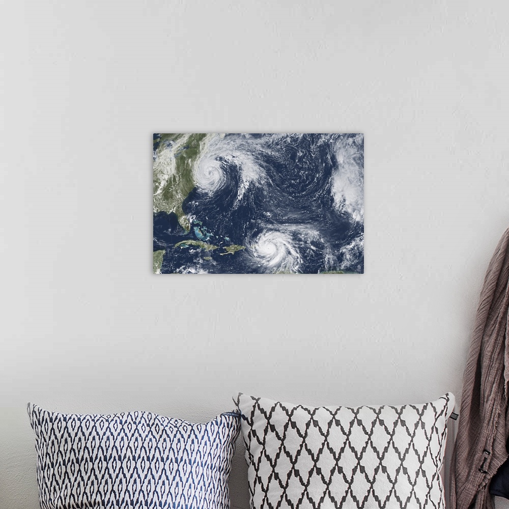 A bohemian room featuring Hurricane Maria in the Caribbean and Hurricane Jose off the U.S. east coast.