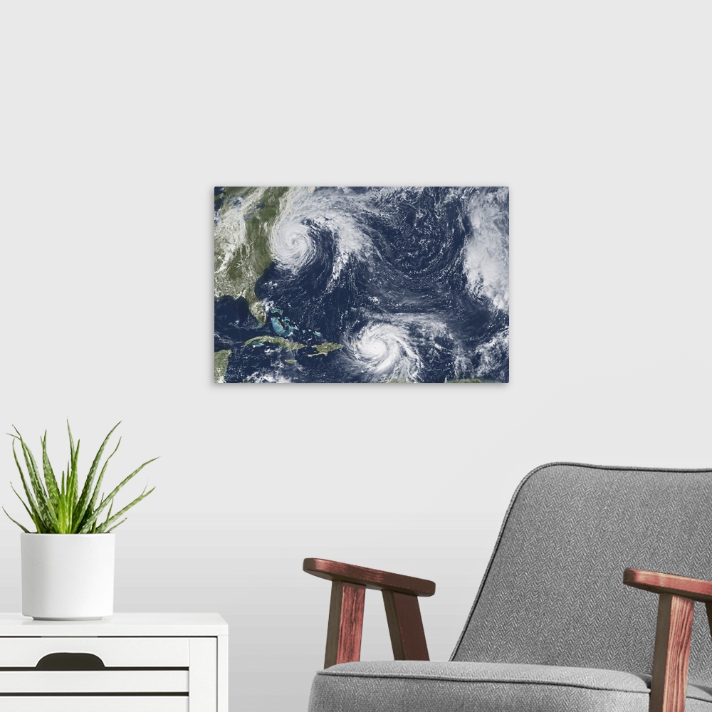 A modern room featuring Hurricane Maria in the Caribbean and Hurricane Jose off the U.S. east coast.