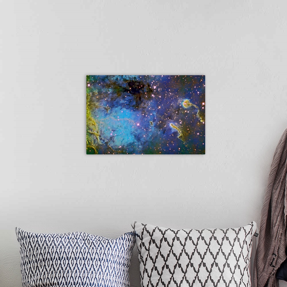 A bohemian room featuring Photograph of galaxy filled with color gas formations and brightly colored stars.