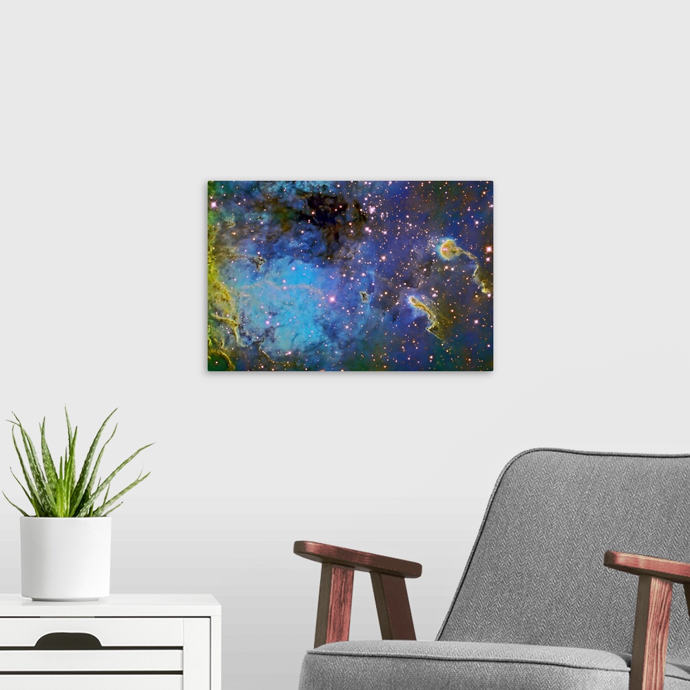 A modern room featuring Photograph of galaxy filled with color gas formations and brightly colored stars.