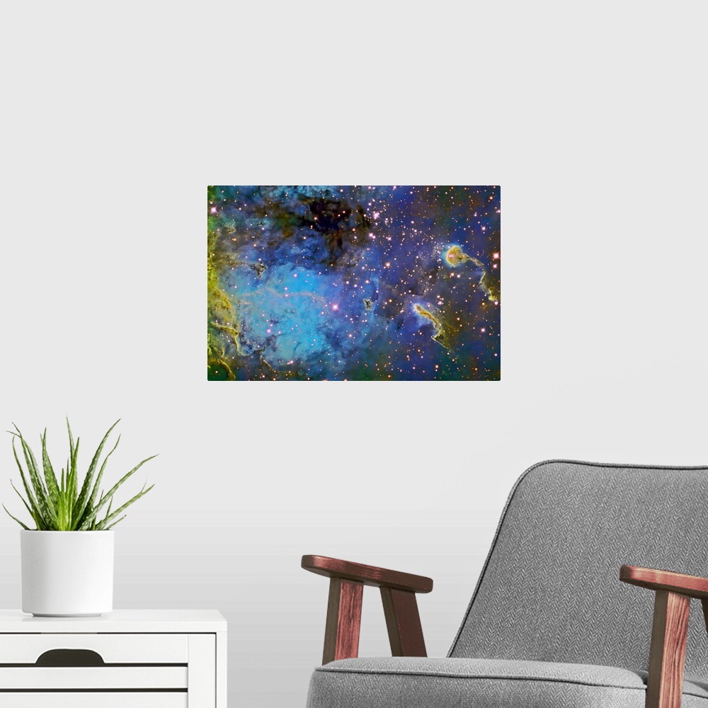 A modern room featuring Photograph of galaxy filled with color gas formations and brightly colored stars.