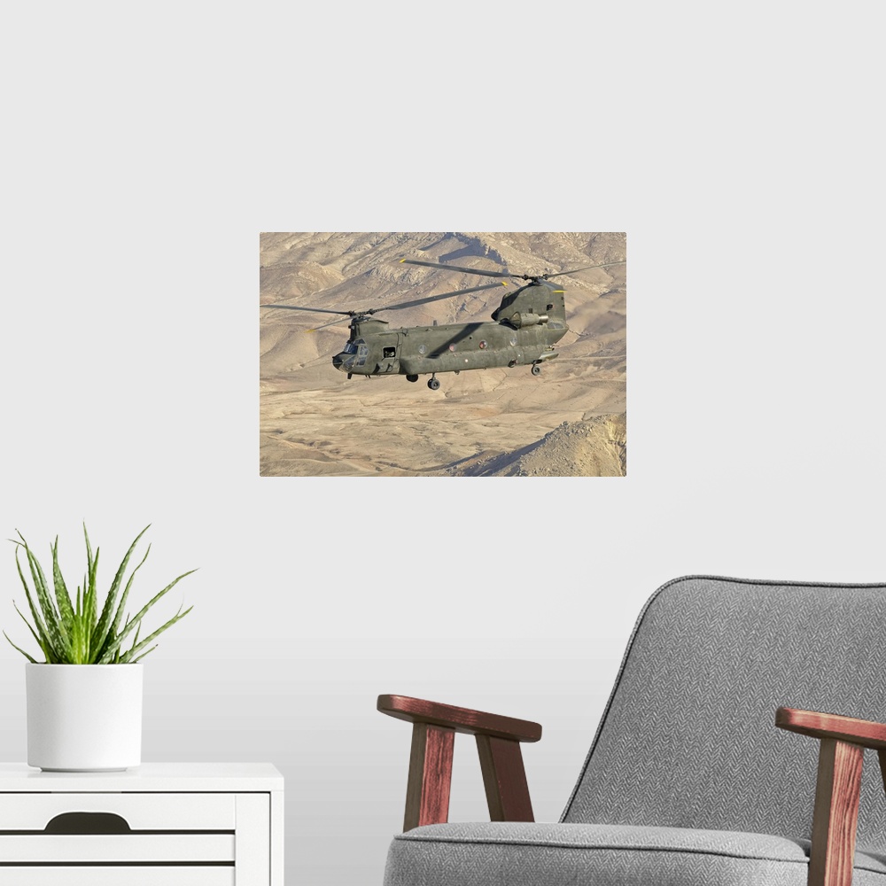 A modern room featuring Italian Army CH-47C Chinook helicopter in flight over Afghanistan in support of the International...