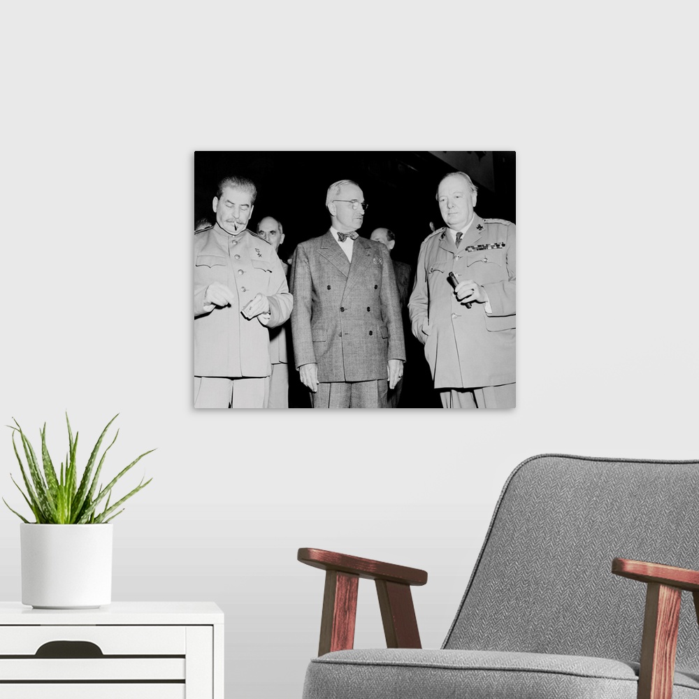 A modern room featuring Vintage World War II photo of Premier Joseph Stalin, President Harry Truman, and Prime Minister W...
