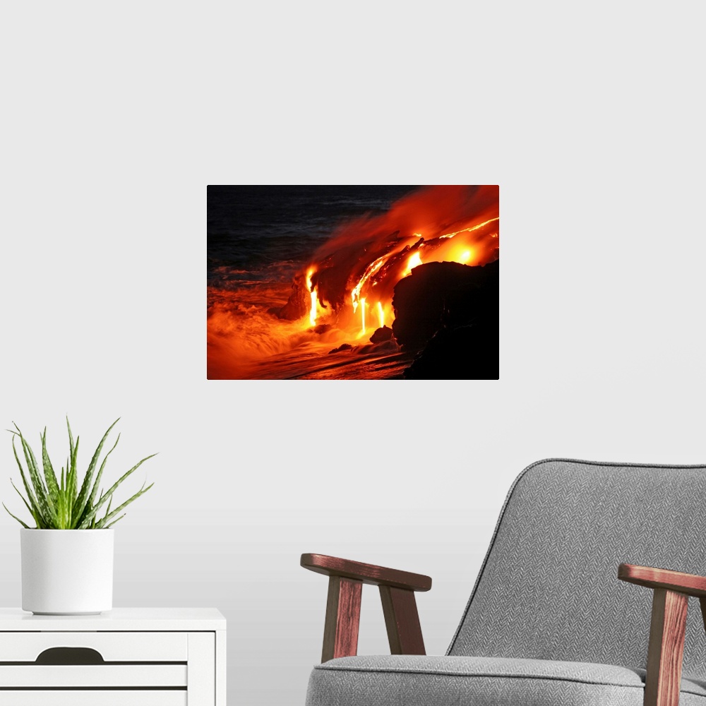 A modern room featuring Photograph of magma running off a rock into the ocean at night.