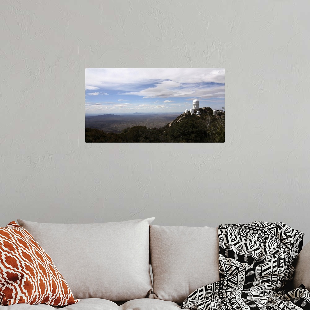 A bohemian room featuring Kitt Peak Observatory domes and surrounding area