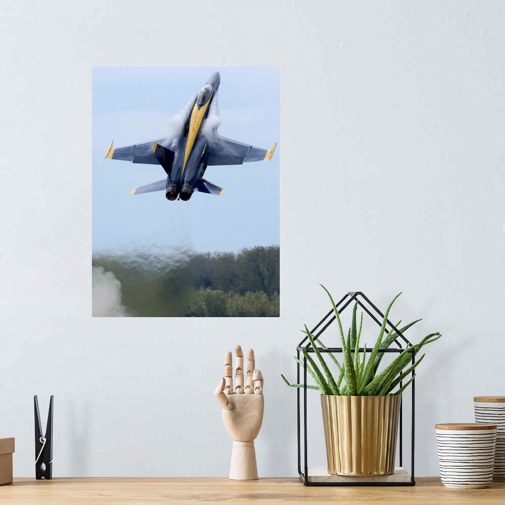 A bohemian room featuring Lead solo pilot of the Blue Angels performs a high performance climb