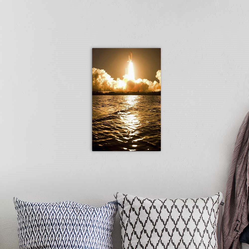 A bohemian room featuring A space shuttle is surrounded by clouds steam from ignition as it rises from the launch pad and h...