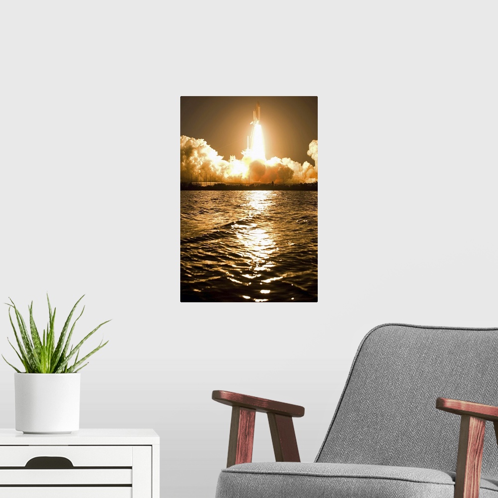 A modern room featuring A space shuttle is surrounded by clouds steam from ignition as it rises from the launch pad and h...