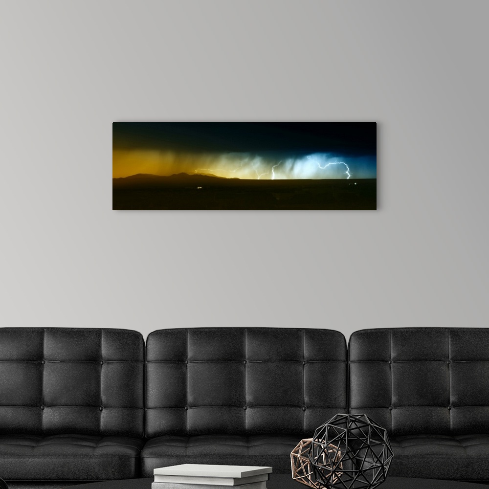 A modern room featuring Dramatic panoramic photograph of a heavy rainstorm with bolts of lightning passing over the South...