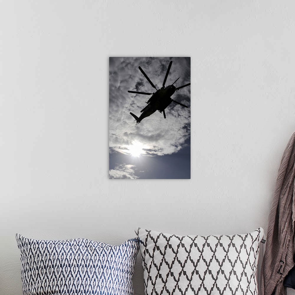 A bohemian room featuring Low angle view of a CH53E Super Stallion helicopter in flight