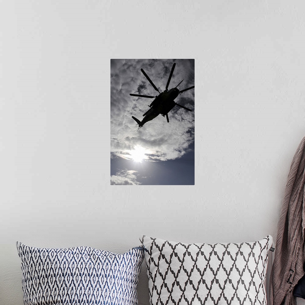 A bohemian room featuring Low angle view of a CH53E Super Stallion helicopter in flight