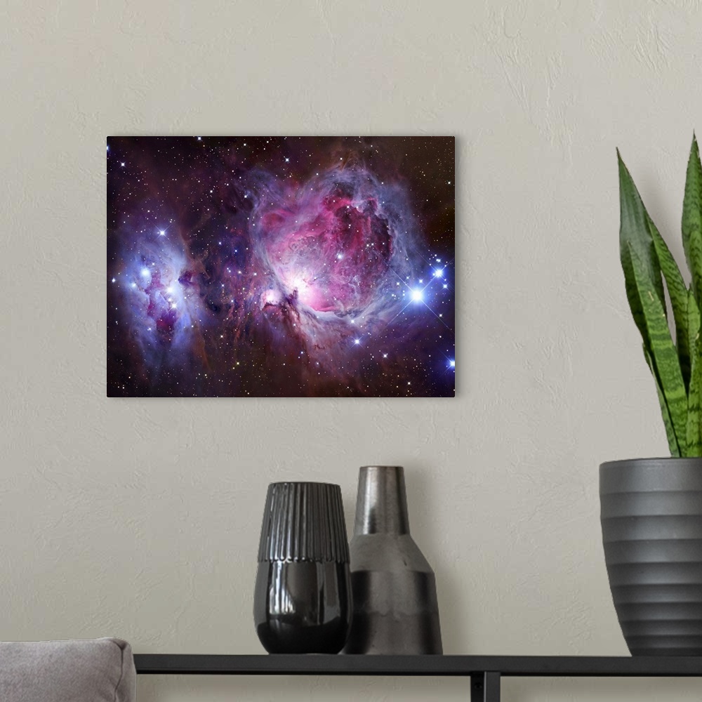 A modern room featuring M42, the Orion Nebula (top), and NGC 1977, a reflection nebula (bottom).