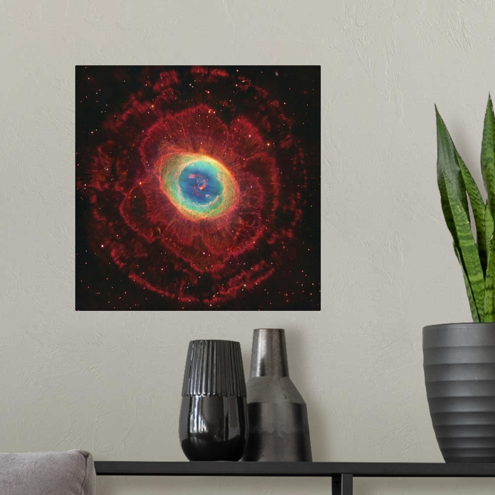 A modern room featuring M57, The Ring Nebula. The inner shell glows green from ionized oxygen and nitrogen while hydrogen...