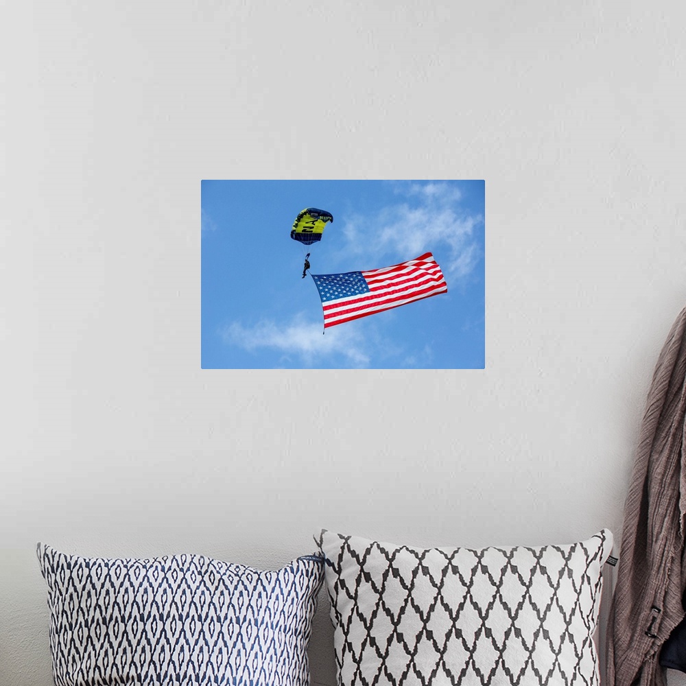 A bohemian room featuring Member of the U.S. Navy Parachute Team flies the American Flag.