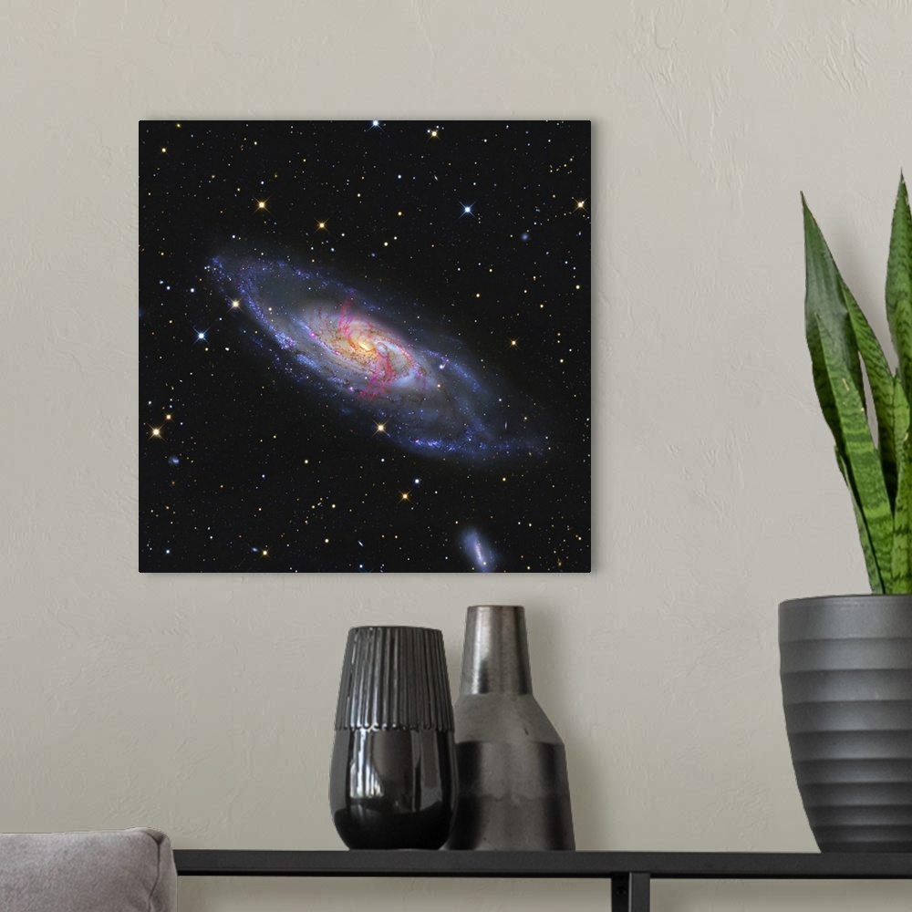 A modern room featuring Messier 106 a spiral galaxy with an active supermassive black hole
