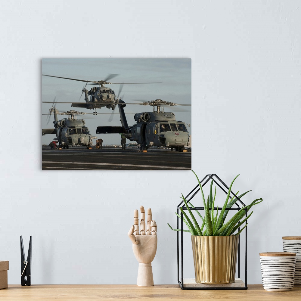 A bohemian room featuring Pacific Ocean, December 21, 2011 - SH-60F and HH-60H Sea Hawk helicopters land on the flight deck...